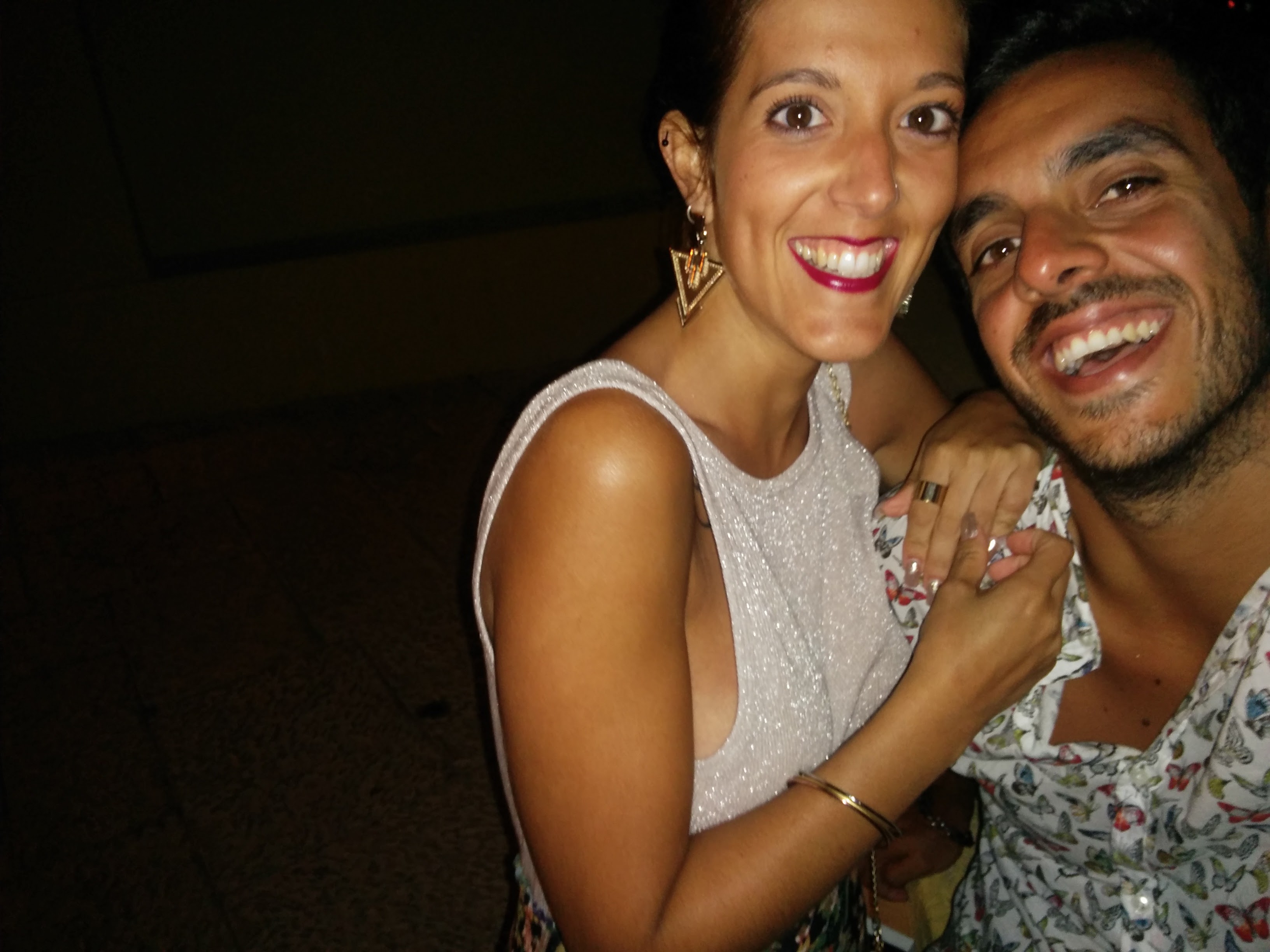 A couple laughing together in a cozy cafe