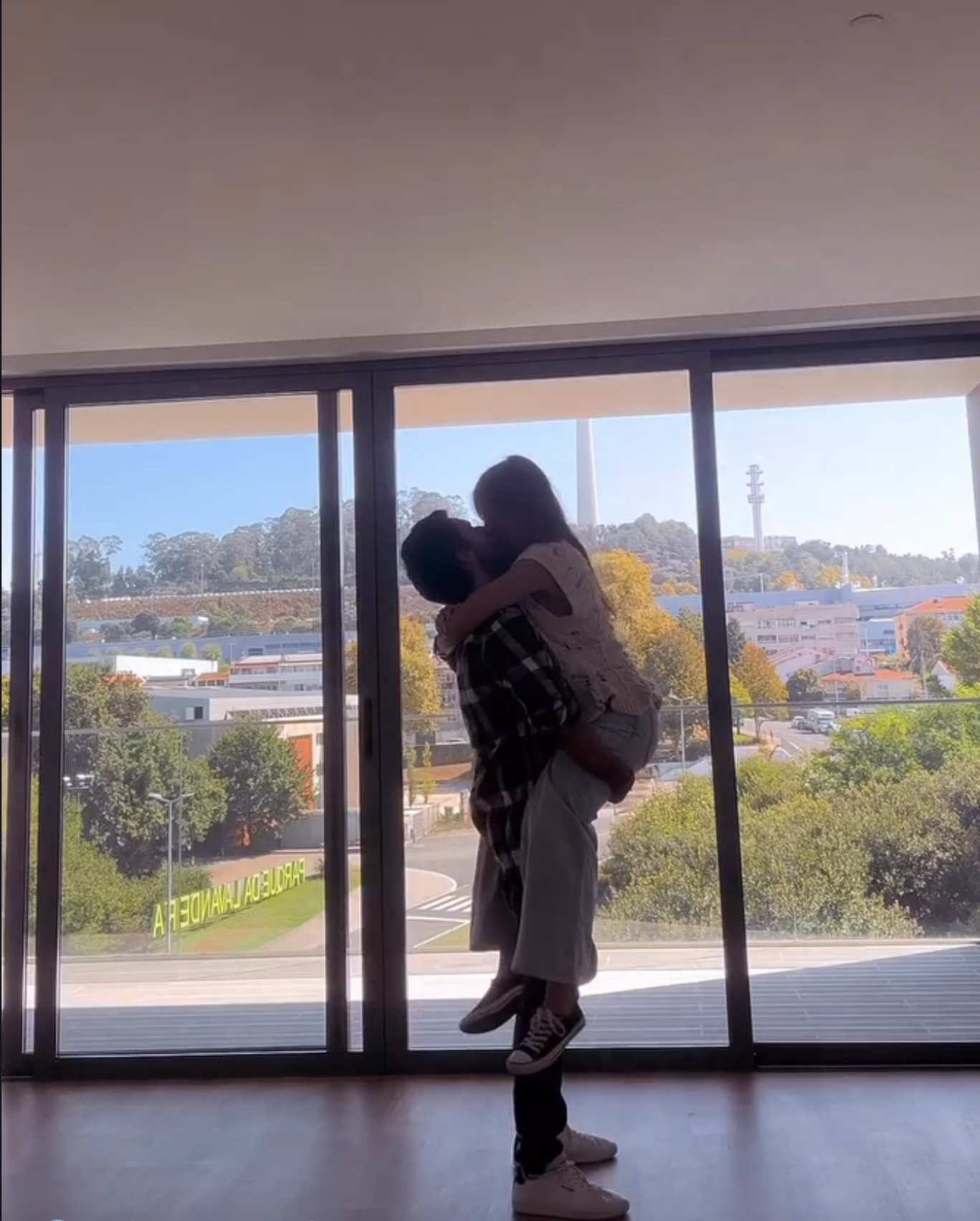 A couple unpacking boxes in their new home.